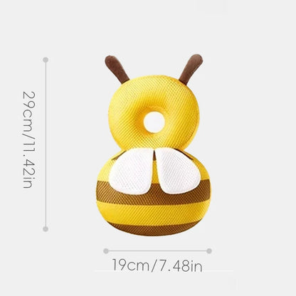 Yellow and brown bee-shaped pillow with dimensions on a white background