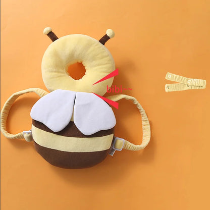Plush bee toy with a red bow on an orange background
