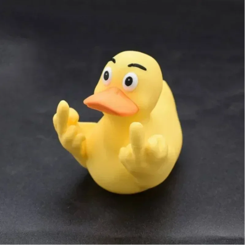 Yellow rubber duck on a black background