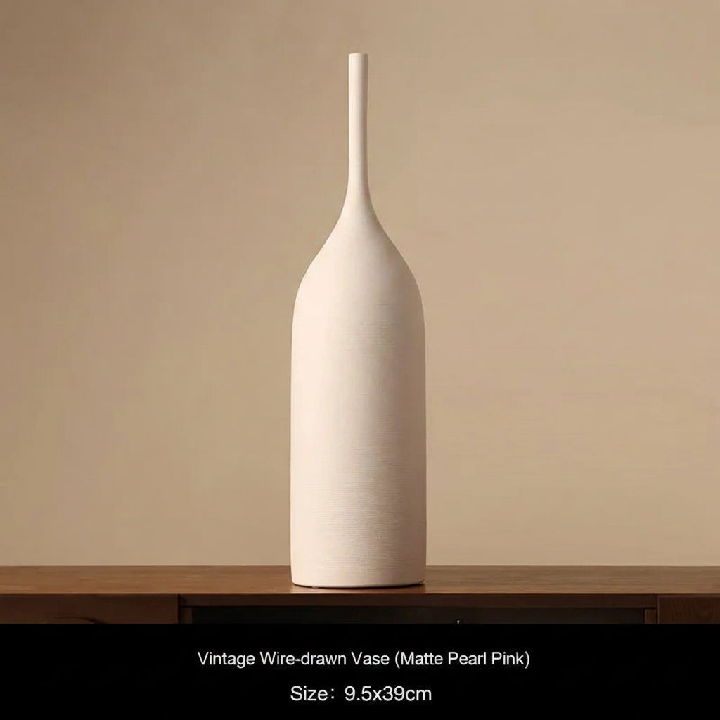 Matte Pearl Pink Ceramic vase on a wooden surface with a beige background 
