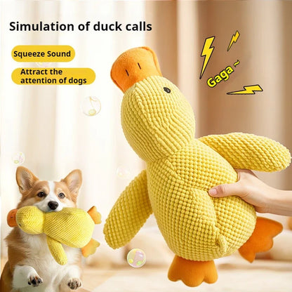 Yellow duck-shaped toy with text on a neutral background