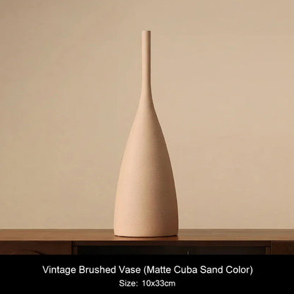 Matte Cuba Sand Beige ceramic vase on a wooden surface with a beige background