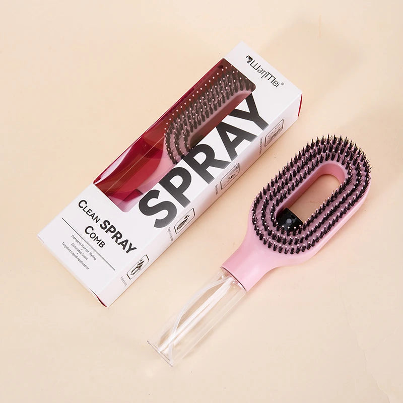 Pink cleaning comb with a transparent handle and black bristles, next to its packaging on a beige background.